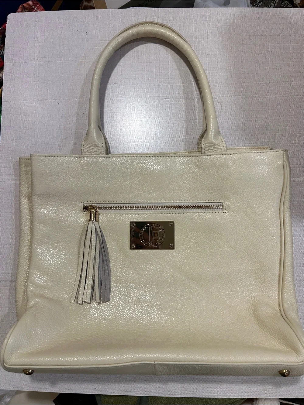 Structured Cream Leather Tote with Tassel Accent